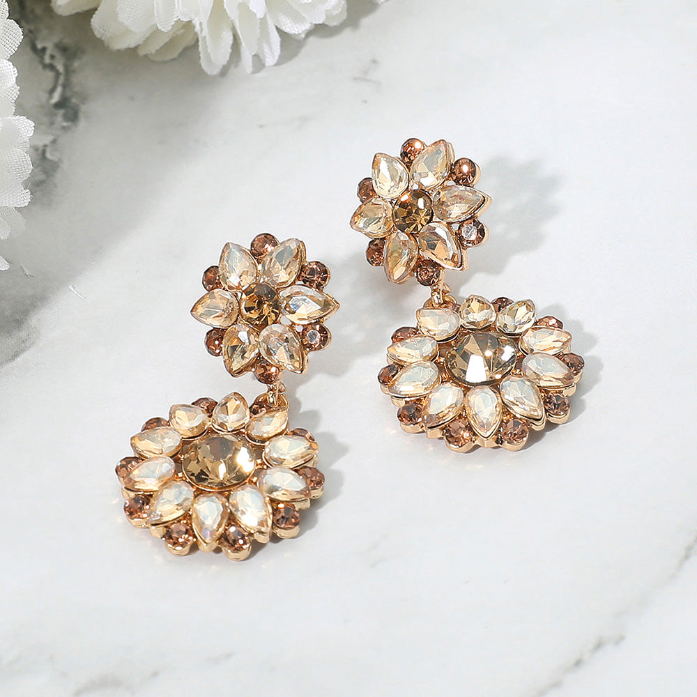 Light topaz floral stone cluster earrings with silver finish for weddings or pageants on a white background
