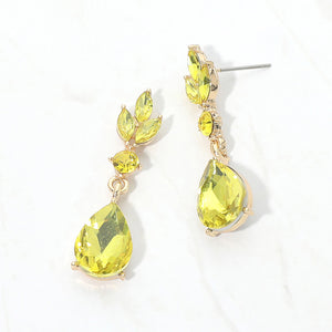 Yellow crystal teardrop earrings on gold with a large pear-shaped bottom crystal and smaller marquise and round crystal accents, displayed on a white background.