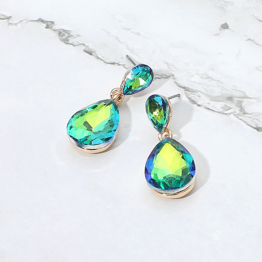 
Small Green AB Crystal Teardrop Dangle Earrings | Little Girls | Older Girls Interview on a white marble background