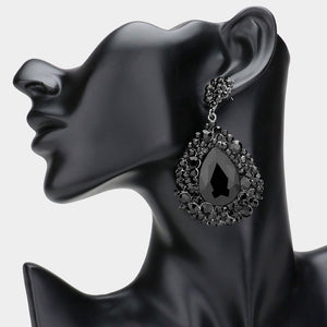 Black teardrop statement earrings highlighting layered rhinestone accents, bold contrast, and elegant movement on a black mannequin's ear on a white background