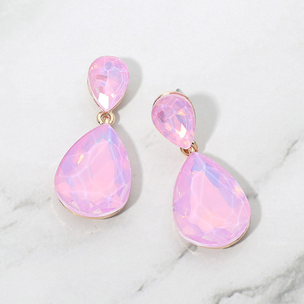 Lavender opal crystal double teardrop dangle earrings on gold displayed on a white marble background.