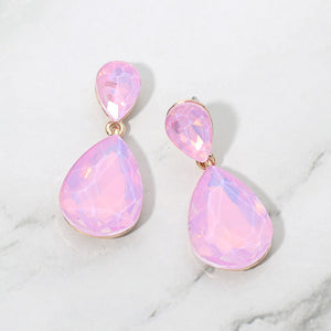 Lavender opal crystal double teardrop dangle earrings on gold displayed on a white marble background.