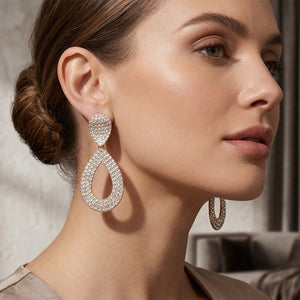 clear crystal rhinestone pavé cut out teardrop pageant and formal earrings on gold shown here on a model