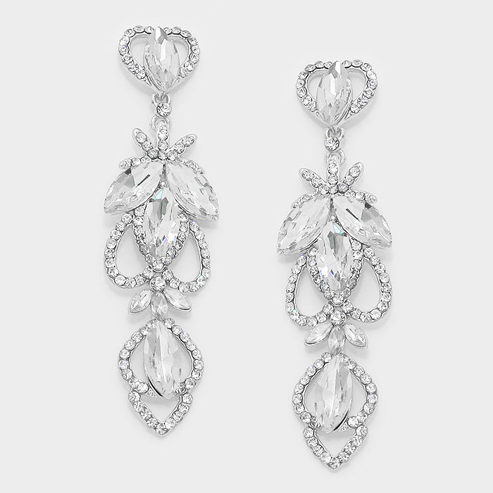 Pair of silver chandelier earrings with clear gemstones on a light gray background