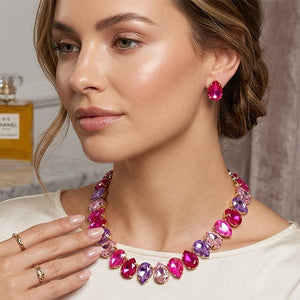 Pink and Fuchsia Hot Pink teardrop crystal prom necklace set on gold displayed on a model