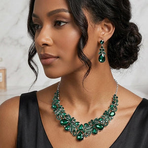 Emerald Green teardrop floral statement necklace and earrings set on silver worn by model