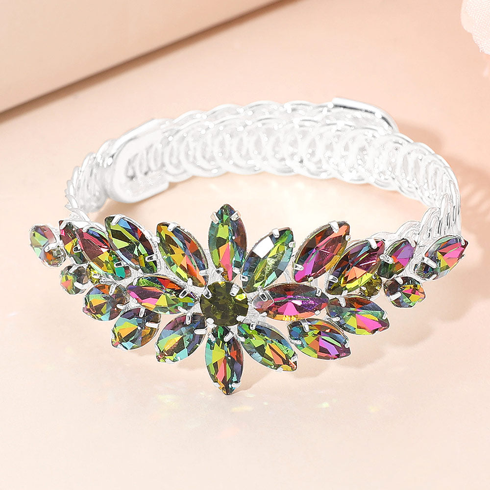 Multi-color crystal floral marquise adjustable bracelet on silver displayed on a beige background.