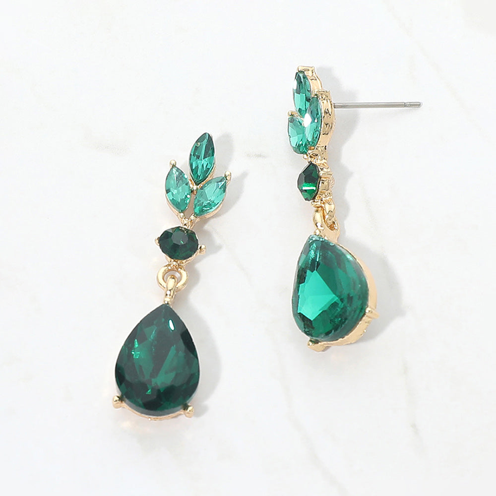 Emerald Green crystal teardrop earrings on gold with a large pear-shaped bottom crystal and smaller marquise and round crystal accents, displayed on a white background.