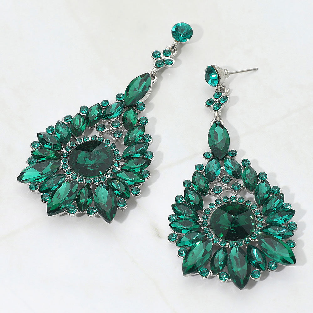Emerald green marquise and round teardrop statement earrings for prom or pageant evening wear on a white background