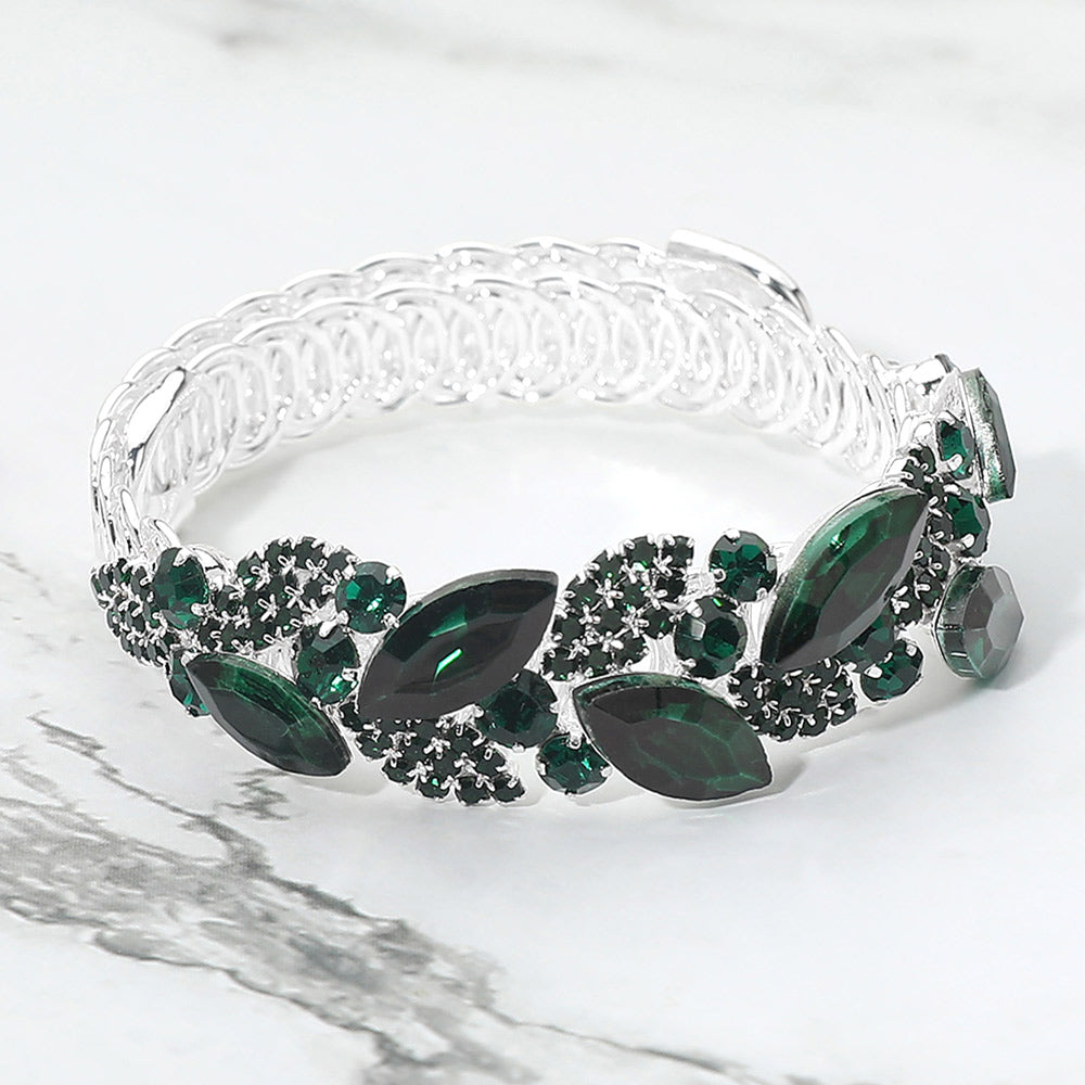 Emerald Green marquise stone cluster adjustable bracelet on silver on marble surface