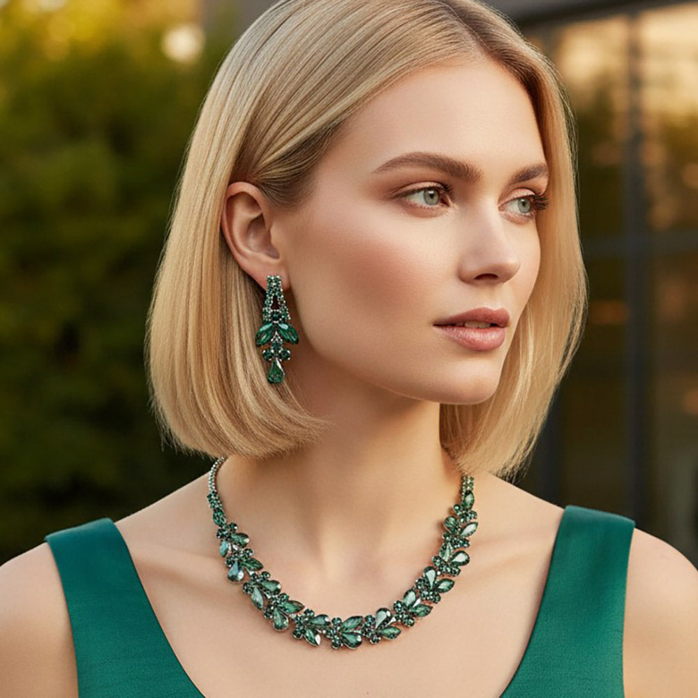Model wearing emerald green marquise and teardrop rhinestone prom and evening necklace set on silver