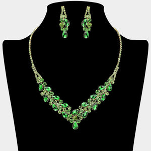 Emerald Green teardrop rhinestone necklace set with V-shaped crystal design and matching earrings, all backed in gold, for prom and formal wear. Shown on a black mannequin bust.  