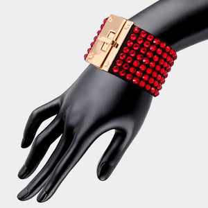 Red on black 7-row rhinestone bling studded bracelet with gold hardware on a mannequin's wrist