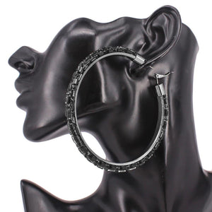 Jet Black Oversized Baguette Rhinestone Hoop Earrings on Black – 3.5" with Omega Back on a black mannequin ear