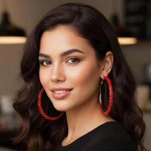 Red oversized baguette rhinestone hoop earrings on gold worn on model