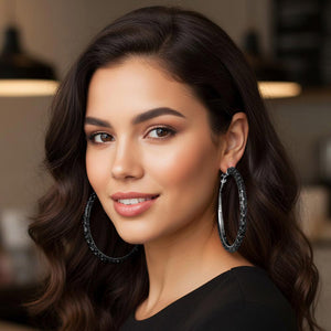 Jet black oversized baguette rhinestone hoop earrings on silver with omega back on a model