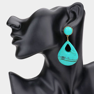 Turquoise Resin Teardrop Cutout Dangle Earrings on a black mannequin ear on a white background – Modern Statement Style 3.25" 
