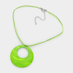 Lime Green open-circle necklace on silver with an oversized round pendant displayed on a white background.