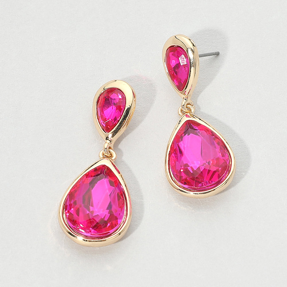 Gold-tone drop earrings with faceted fuchsia hot pink double teardrop crystals, displayed on a clean white background.