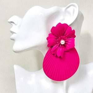 Oversized hot pink - fuchsia flower fan statement earrings with layered floral tops and large pleated fan drops, displayed on a white jewelry mannequin.