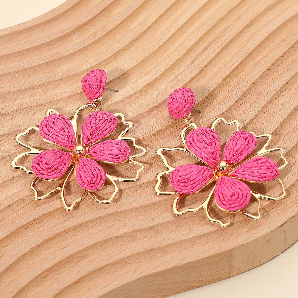 Fuchsia raffia floral dangle earrings with bold petal design and boho statement style. Fun fashion earrings for runway, pageants, and appearances.