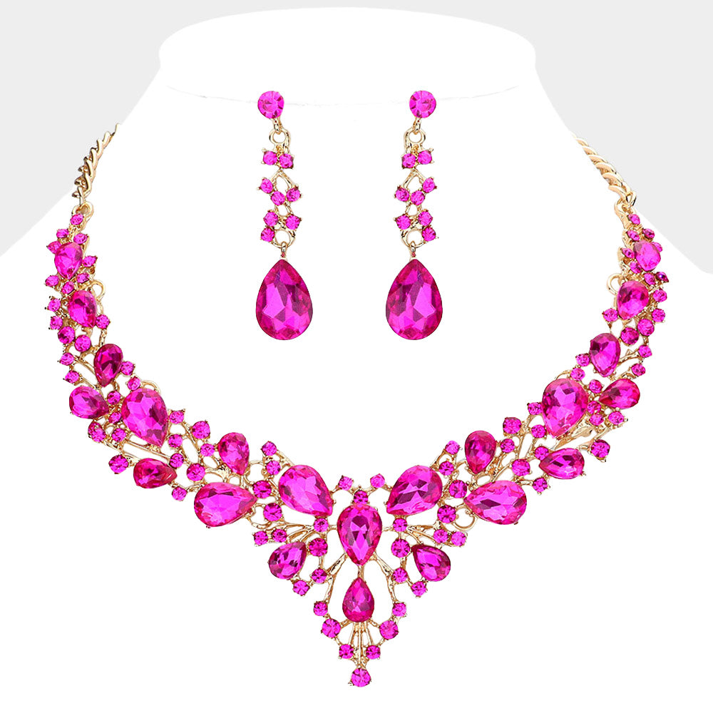 Fuchsia hot pink teardrop and round stone statement necklace set with matching drop earrings on gold on white background