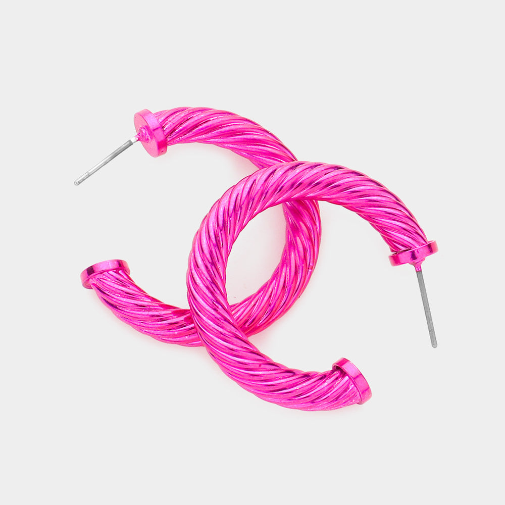 Fuchsia hot pink twisted rope texture hoop earrings 1.25 inch shown on a white background