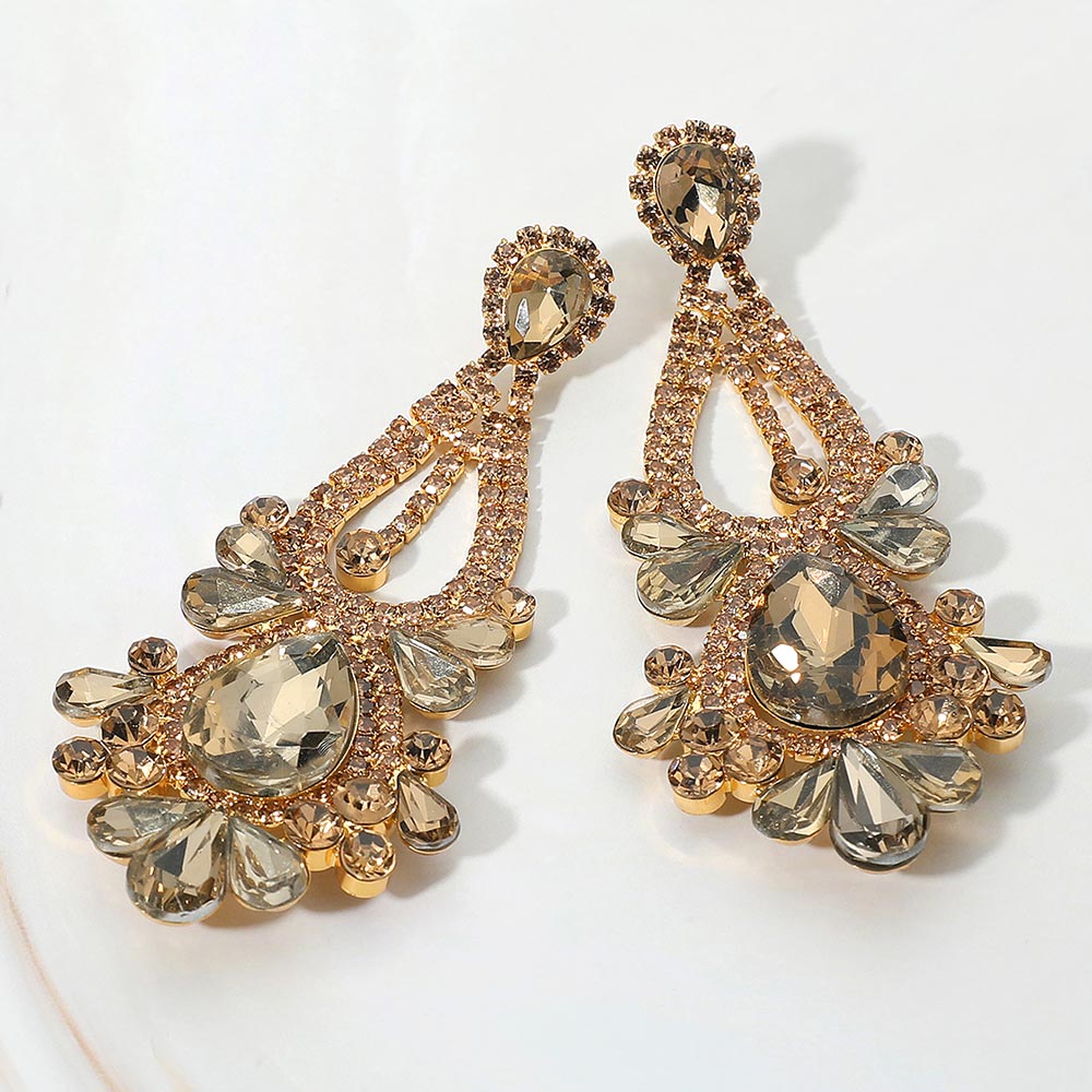 Gold stone topaz teardrop chandelier statement earrings for prom or pageant evening wear on a white background
