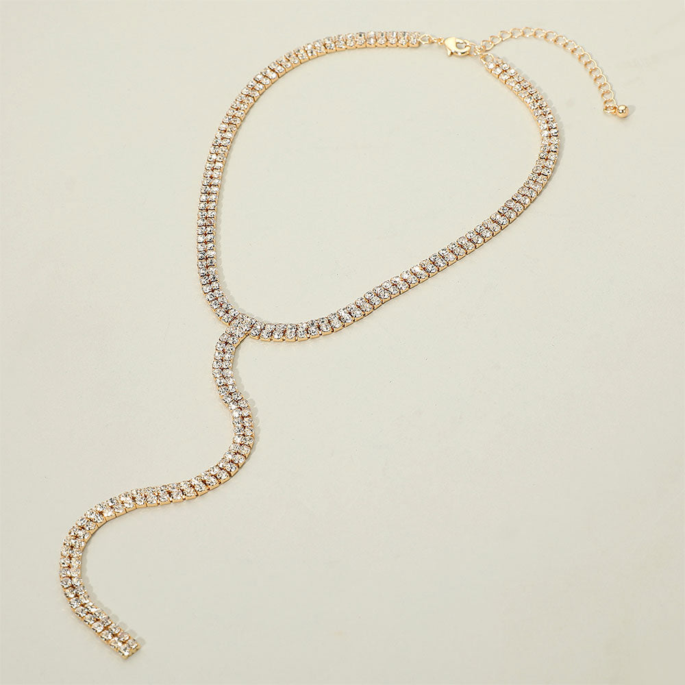 Gold dipped rhinestone Y necklace with two cascading strands and drop design on a white background for formal occasions