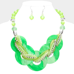 Green chunky round link statement necklace set with matching earrings on white bust