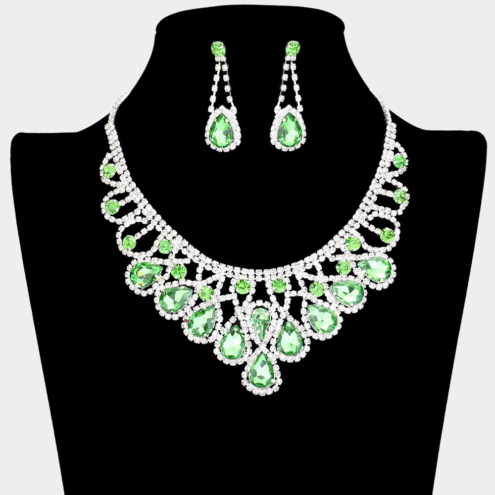 Light Green crystal teardrop and rhinestone prom necklace set on silver displayed on black mannequin necklace bust