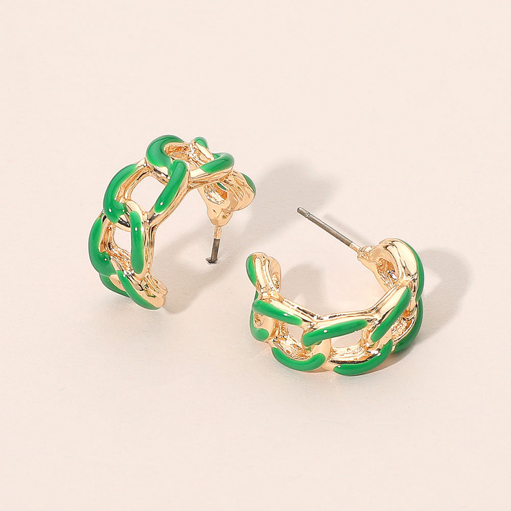 Green enamel chain hoop earrings with mini linked half-hoop design and post-back closure on a beige background