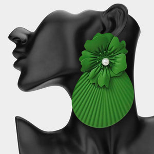 Oversized green flower fan statement earrings with layered floral tops and large pleated fan drops, displayed on a black jewelry mannequin.
