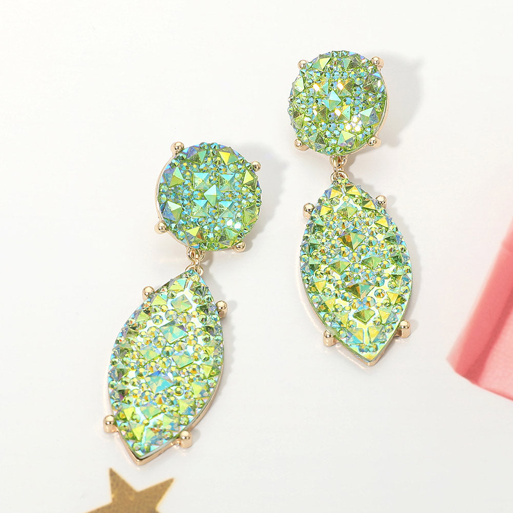 Iridescent emerald green and AB rhinestone marquise drop pageant earrings on gold on a white background