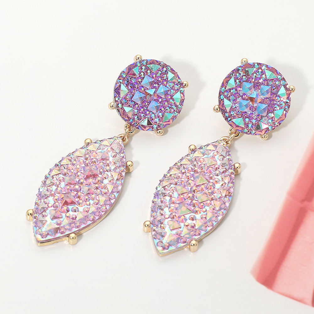 Iridescent lavender and AB rhinestone marquise drop pageant earrings on gold on a white background