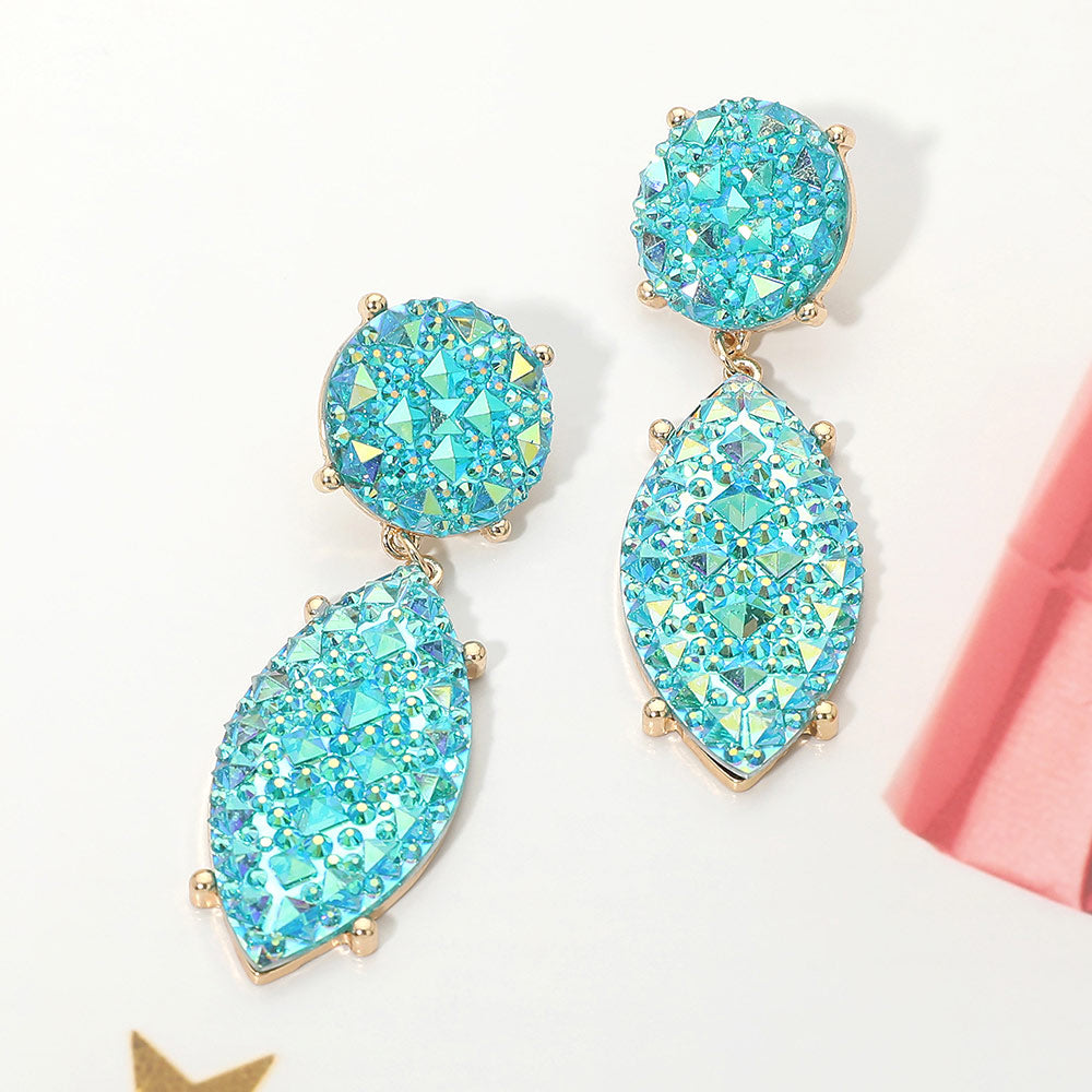 Iridescent turquoise and AB rhinestone marquise drop pageant earrings on gold on a white background