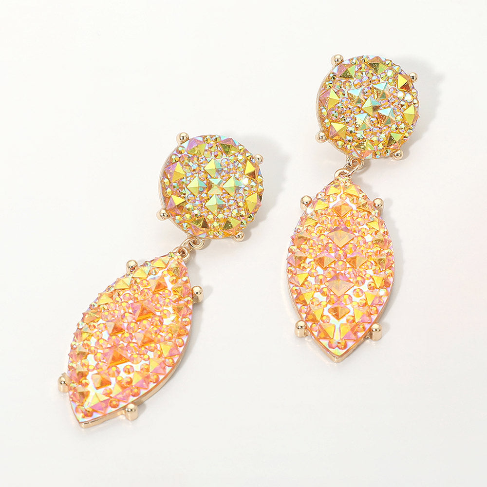 Iridescent yellow and AB rhinestone marquise drop pageant earrings on gold on a white background