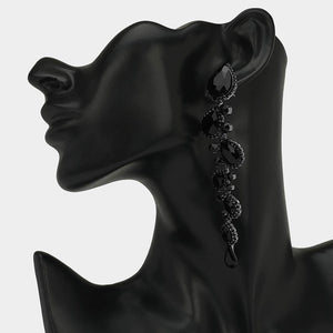 Black long teardrop pageant earrings with 4.3 inch drop shown on a black mannequin ear