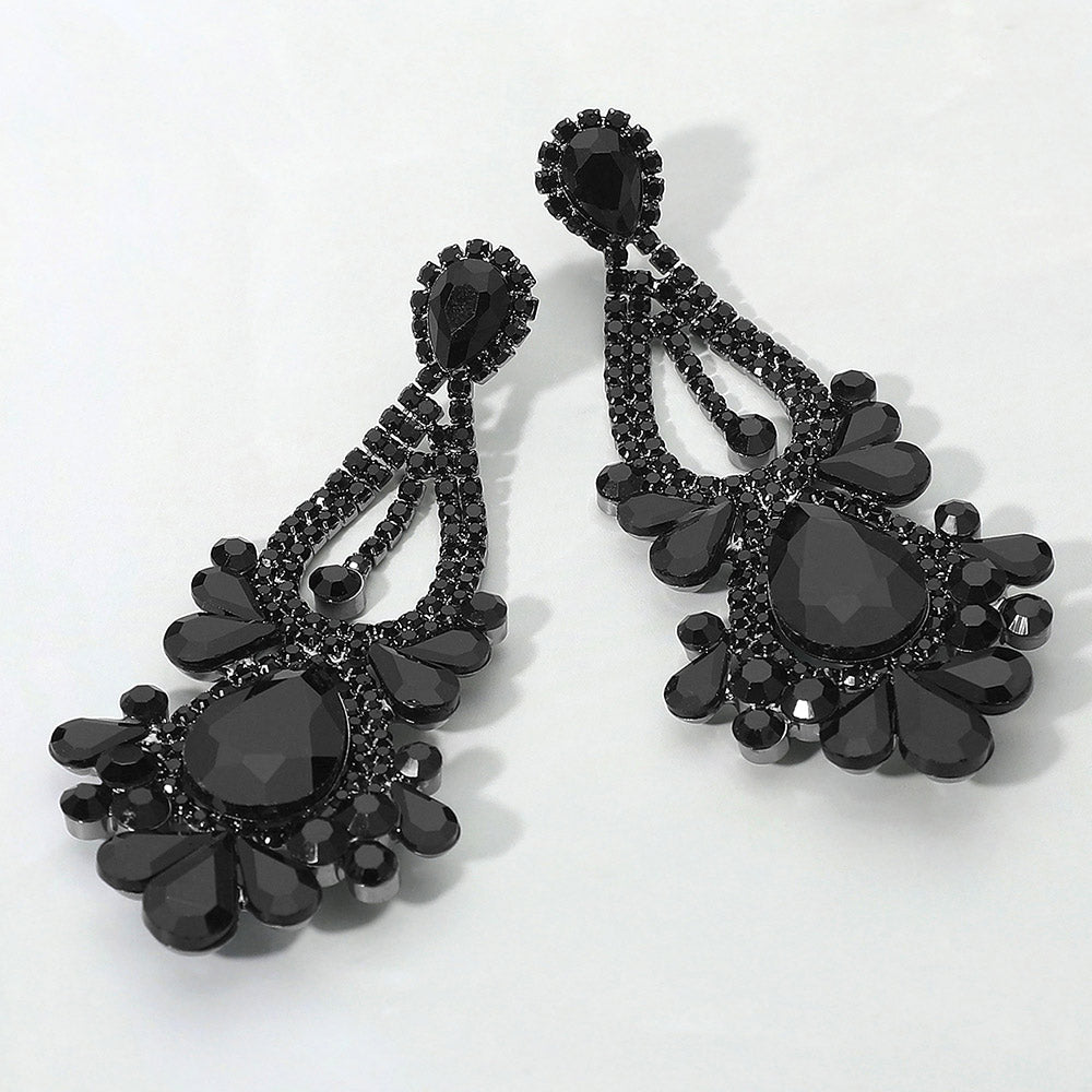 Jet black teardrop chandelier statement earrings for prom or pageant evening wear on a white background
