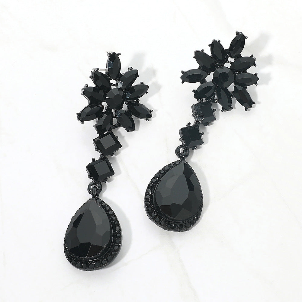 Jet black crystal flower teardrop earrings featuring marquise crystal flower tops and large faceted black teardrop drops in a black finish, displayed on a white background.