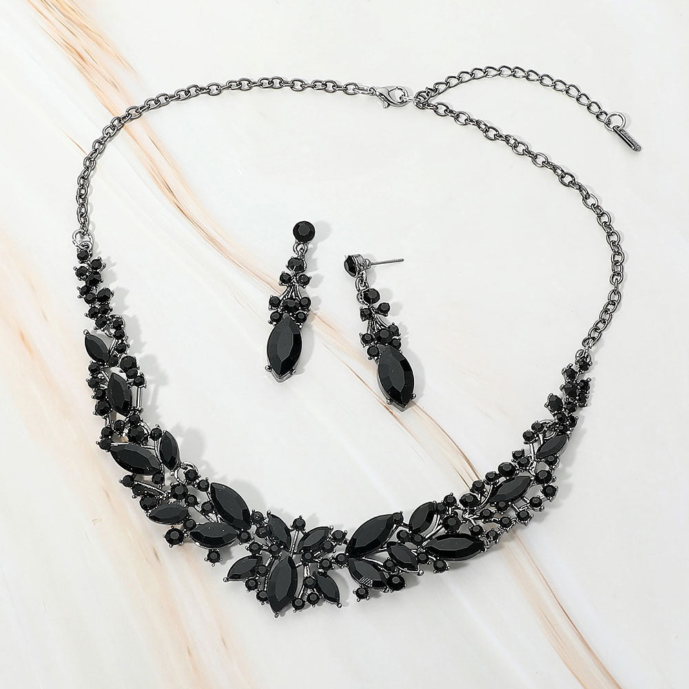 Jet Black marquise stone cluster prom and evening necklace set on black on white marble background