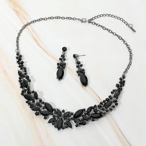 Jet Black marquise stone cluster prom and evening necklace set on black on white marble background
