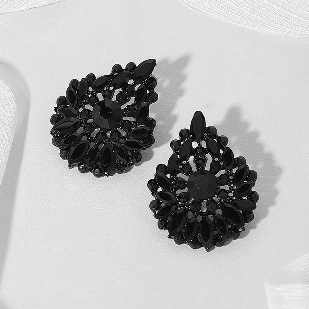 Jet black marquise stone cluster teardrop earrings on black on a white background