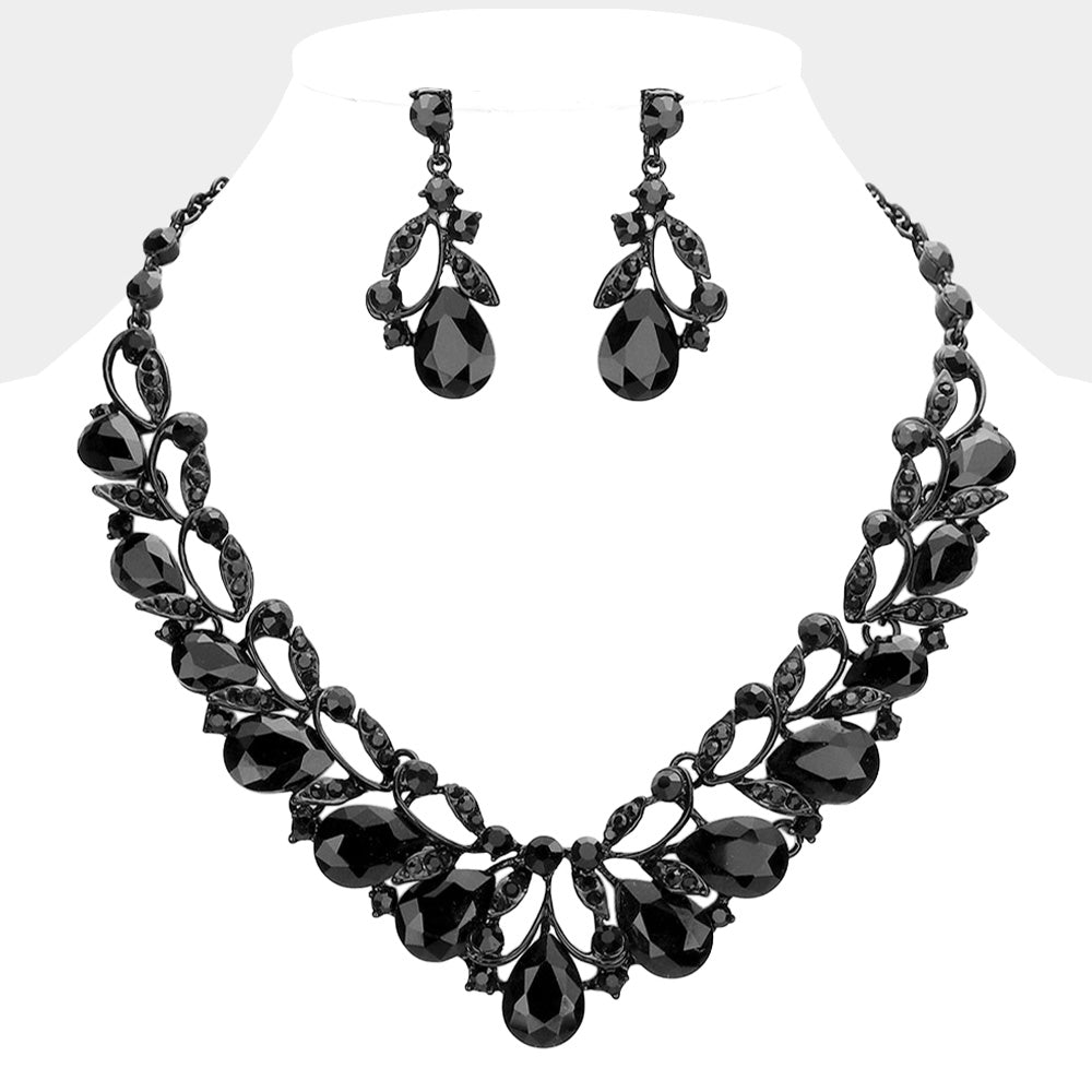 Jet black teardrop leaf crystal statement necklace set with matching earrings in a black setting on a white background