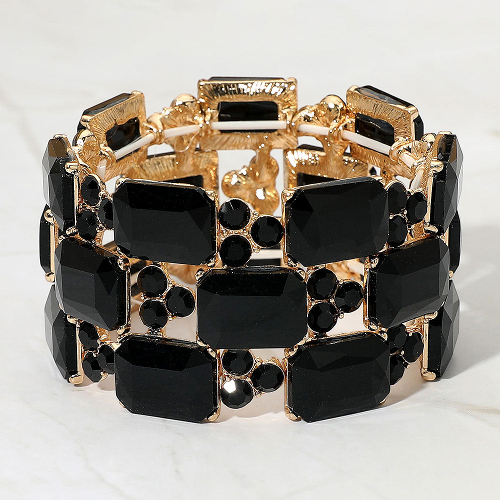 Jet Black wide emerald cut crystal stretch bracelet on gold on white background