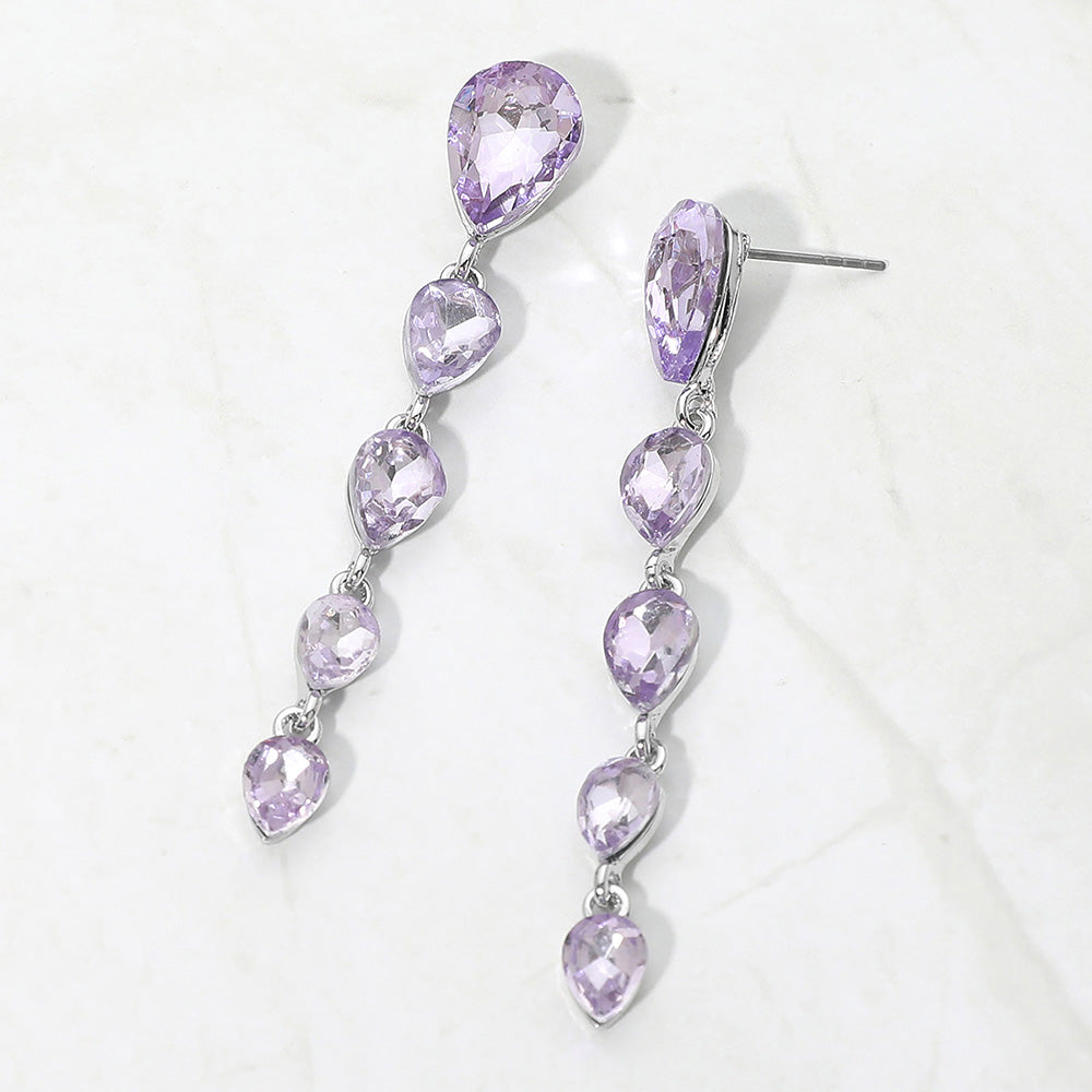 Pair of long lavender on silver multi teardrop earrings on a white background