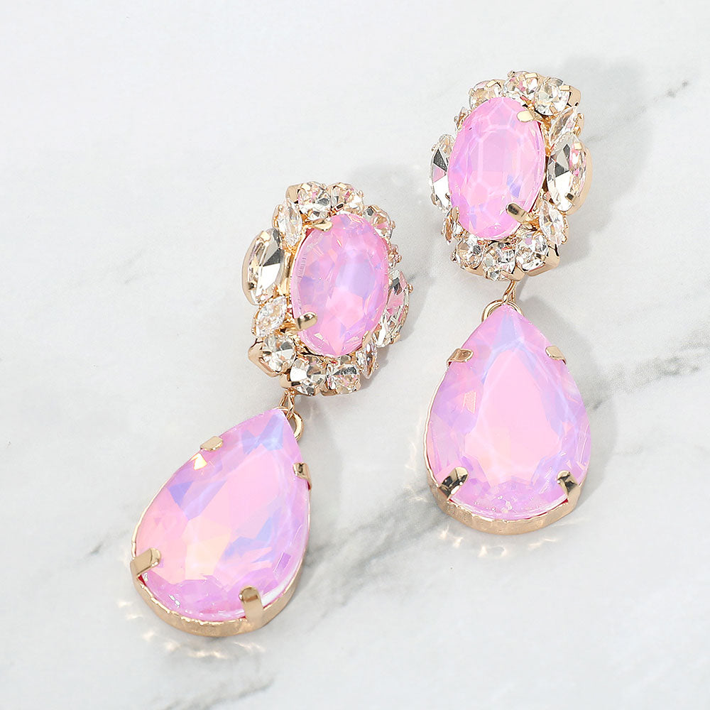 Lavender oval and teardrop dangle earrings on gold on a white marble background