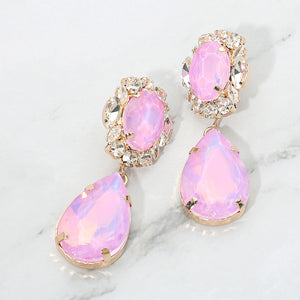 Lavender oval and teardrop dangle earrings on gold on a white marble background