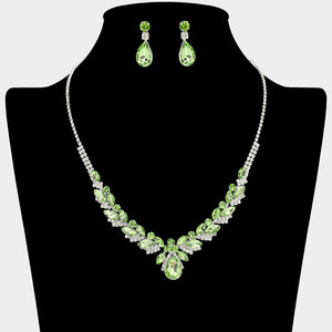 Light green teardrop marquise prom necklace set on silver with matching earrings displayed on a black mannequin bust on a white background.