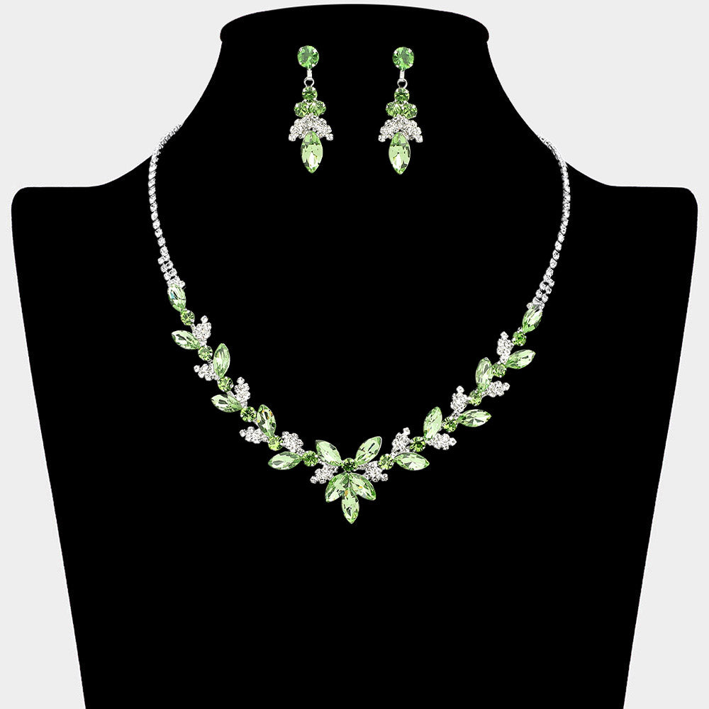 Light green marquise floral rhinestone necklace set on silver displayed on black bust background
